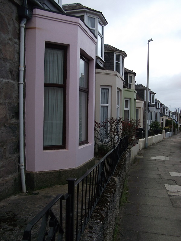 a row of houses of different colours