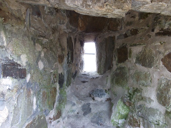 A tiny window in the wall of a castle