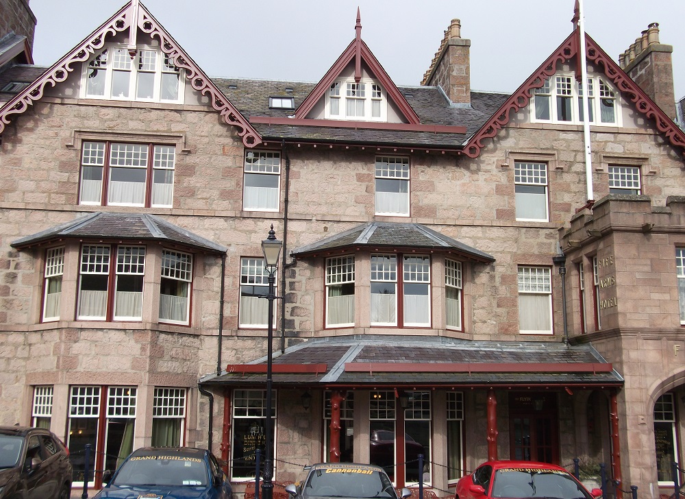 A large hotel with triangular gables and red rimmed windows